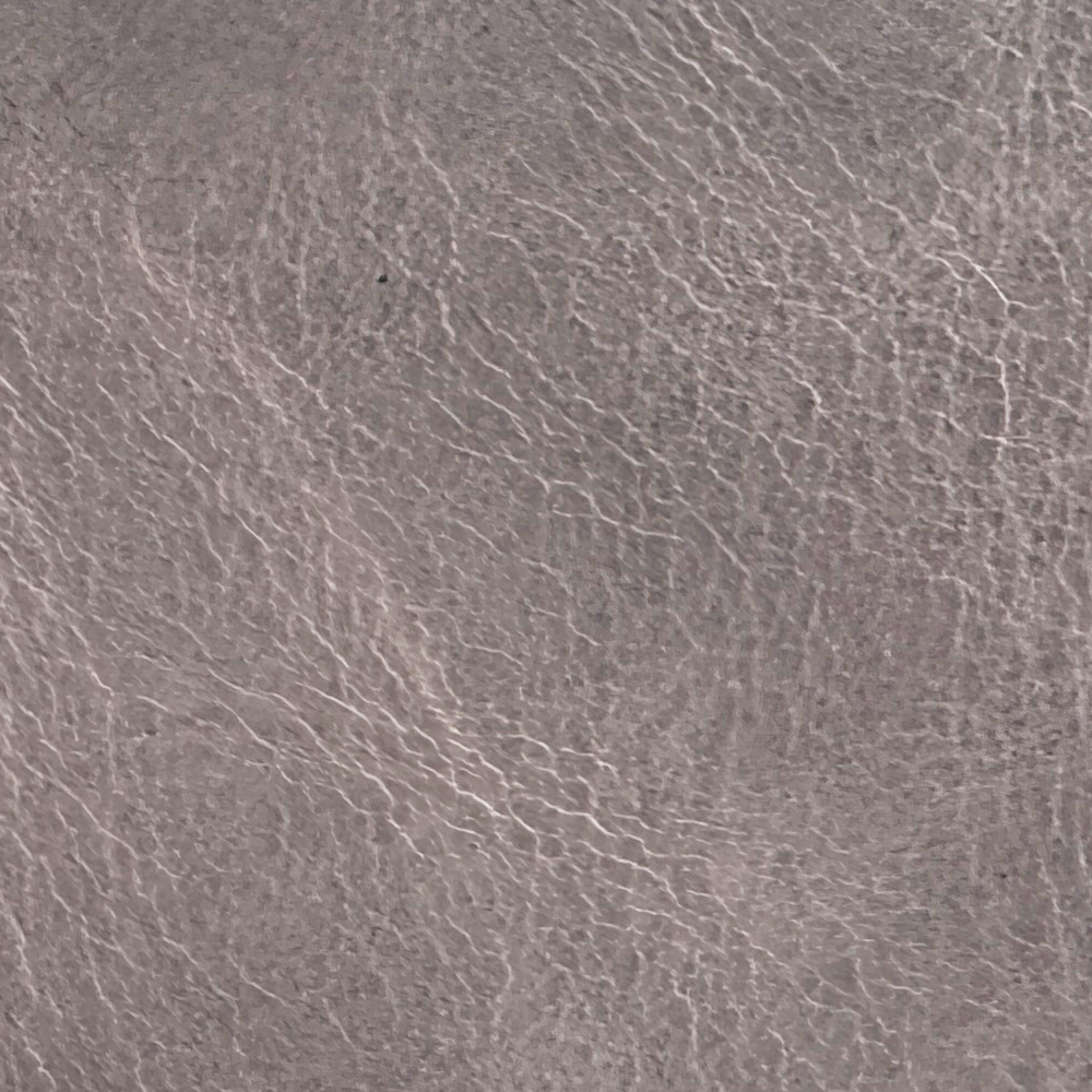 Name: Vintage Oil Wax Leather
Material: Top-Grain Cowhide (Pull-up / Oil Wax)
Surface Finish: Natural Aniline / Waxed & Oiled Finish
Reference Thickness: Approximately 1.2–1.6 mm; customizable to suit specific requirements

When bent, stretched, or pressed, the oils within the leather migrate, creating a dynamic light-and-dark gradient effect that highlights a rich, vintage aesthetic. Deeply impregnated with natural oils and waxes, the leather possesses a smooth, supple touch with an elegant semi-matte to subtle gloss finish.Featuring a balanced flexibility, it retains the natural toughness of top-grain cowhide while offering excellent impact resistance.
This material is suitable for everyday accessories such as leather phone cases, tablet sleeves, card holders, small wallets, and phone straps.