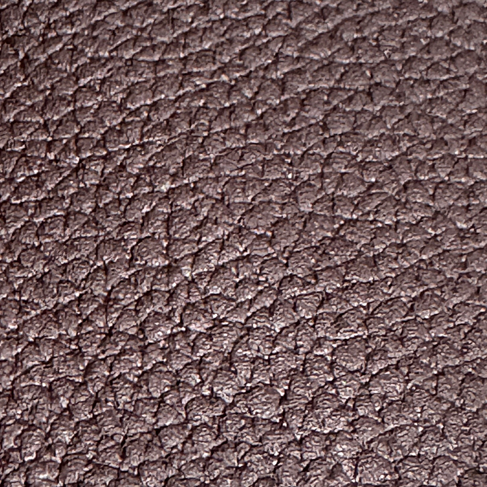 Name: Fine Pebble-Grain Genuine Leather
Material: Cowhide
Surface Finish: Natural grain or embossed grain
Full-Grain / Corrected-Grain Leather: Top-grain leather
Split or Coated Material: Split leather / inner-layer leather

Fine pebble-grain leather features a closely spaced, subtly raised texture that gives the surface a natural, understated dimension. Its textured finish enhances grip and helps make minor signs of everyday rubbing less noticeable, making it well suited to frequently used products such as phone cases, tablet covers, cardholders, small wallets, and phone straps.
Both top-grain and split leather can be finished with a fine pebble-grain texture. They differ in hand feel, overall look and feel, and material cost. The actual leather base, leather type, and surface finish may vary by product; please refer to the product specifications for details.