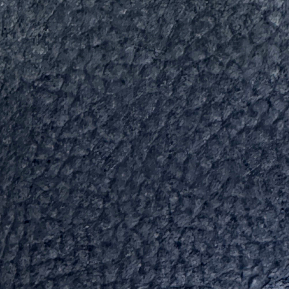 Name: Matte Pebble Grain Leather
Material: Top Grain / Split Cowhide with Matte Pebble Grain (or Microfiber Leather)
Surface Finish: Matte Micro-PU Finish / Buffed Protective Layer (Embossed Lychee / Pebble Grain)
Reference Thickness: Approximately 0.8–1.4 mm; customizable to suit specific requirements

The surface is delicately buffed and matte-finished, eliminating gloss reflective properties to present an understated, premium matte aesthetic with a warm, velvety touch. The uniform and three-dimensional lychee pattern adds visual depth, while the combination of texture and matte finish significantly enhances grip friction, reducing accidental slips while maintaining resistance to daily wear and scuffs. 
This material is suitable for everyday accessories such as leather phone cases, tablet sleeves and folios, cardholders and mini wallets, and leather phone lanyards and straps.