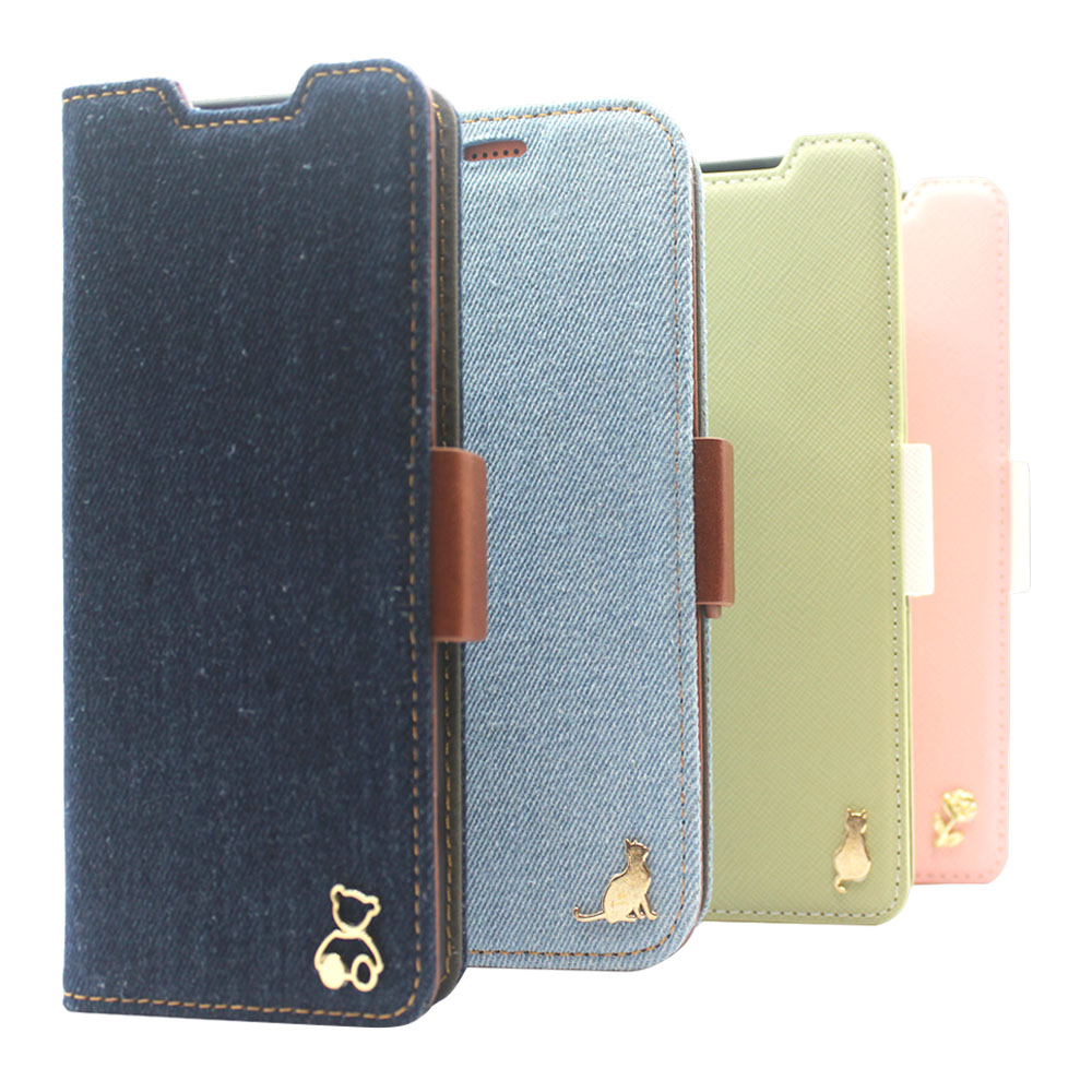 Colorful PU and genuine leather flip phone cases in navy, denim blue, pale green and pink with decorative metal charms, Close-up of navy and pink textured leather flip phone cases with contrast stitching and gold-tone ornaments, Pale green and pink textur